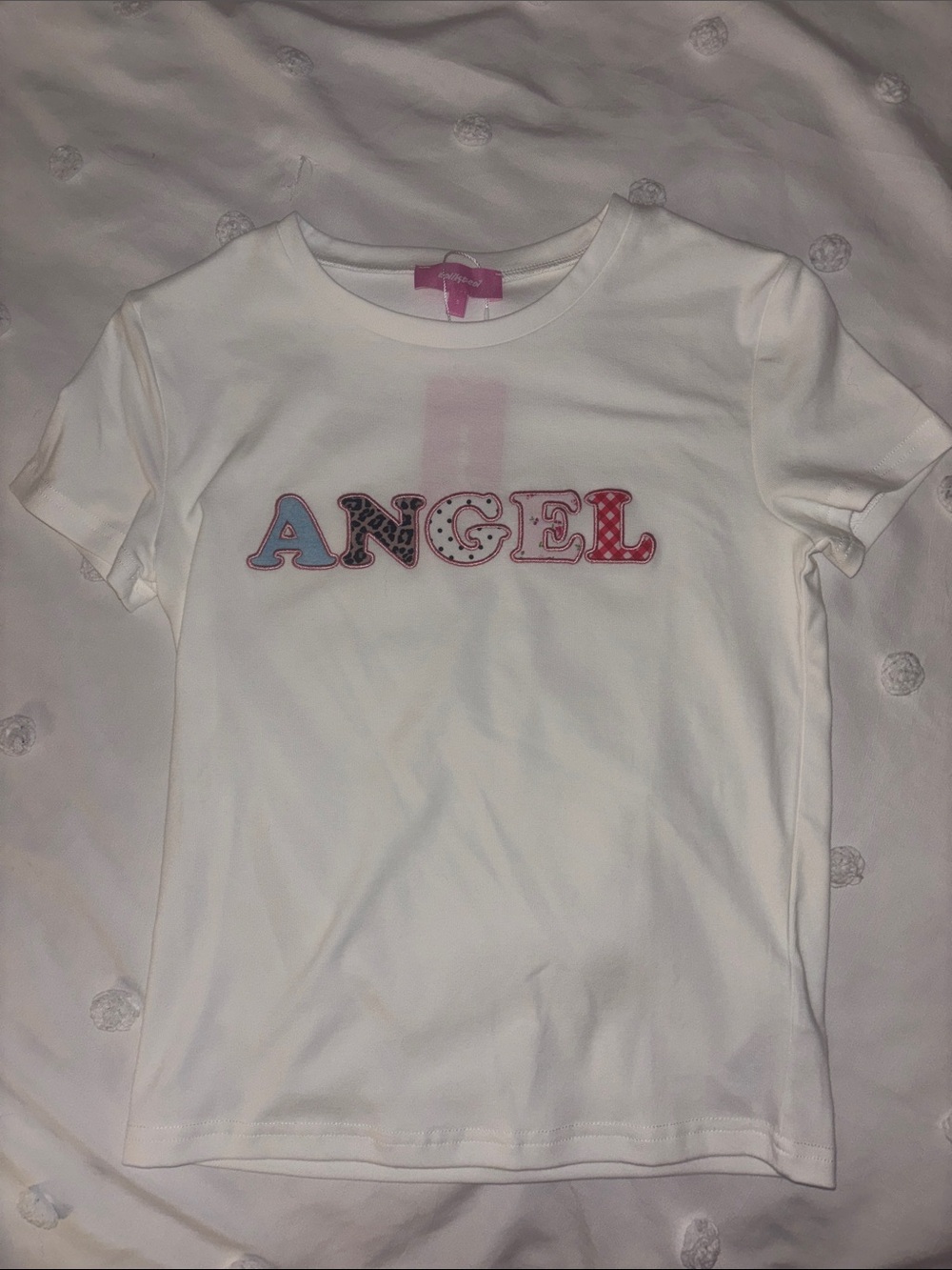 Edikted Women’s White 'Angel' Graphic Tee - Colorful Multi-Patterned Letters